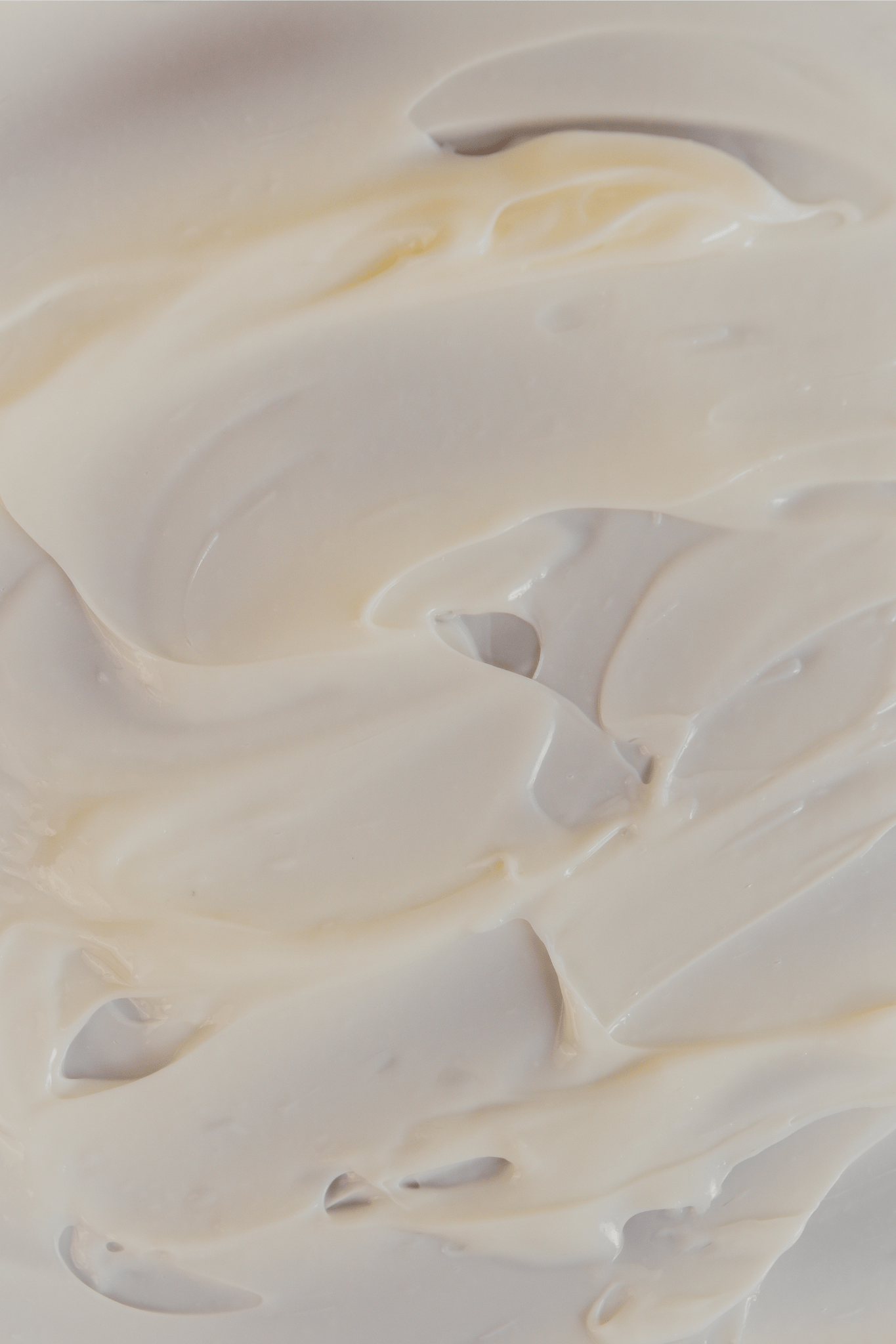 Close-up of smooth, white cream demonstrating texture