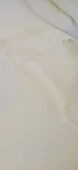 Cream being smoothed out with a tool.